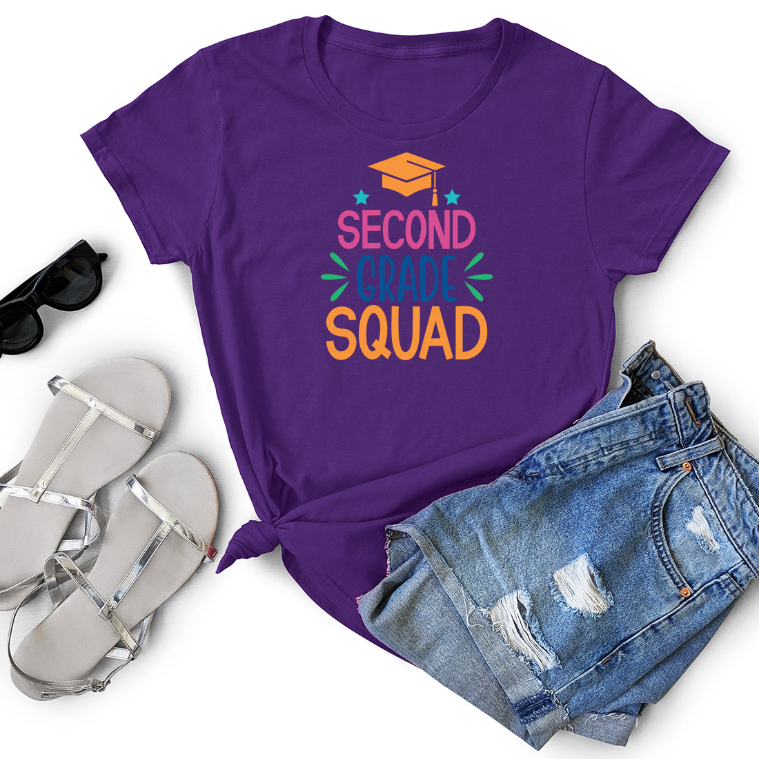 Purple shirt that says second day squad next to a pair of shorts.