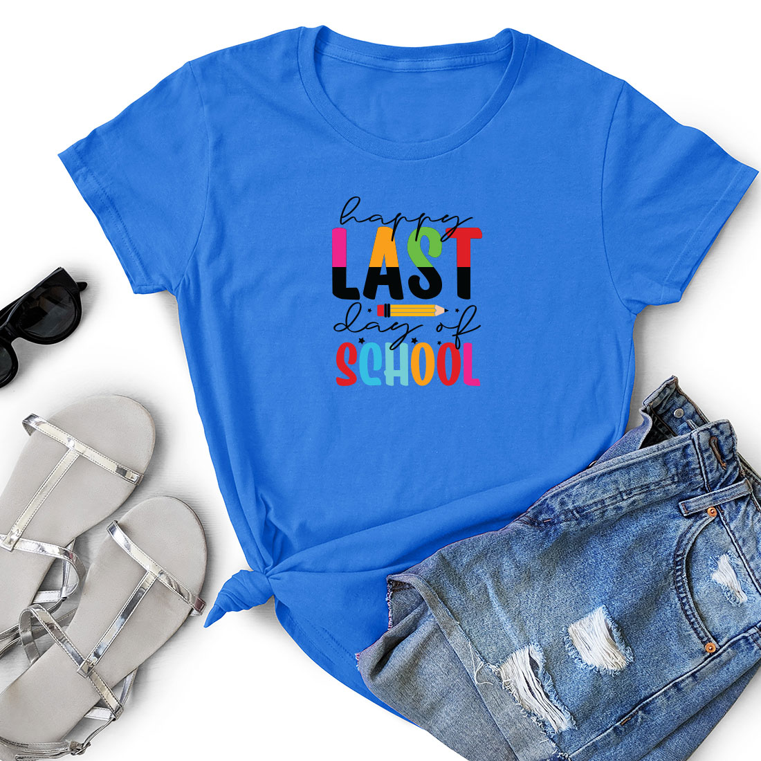 Blue t - shirt that says last day of school next to a pair of.