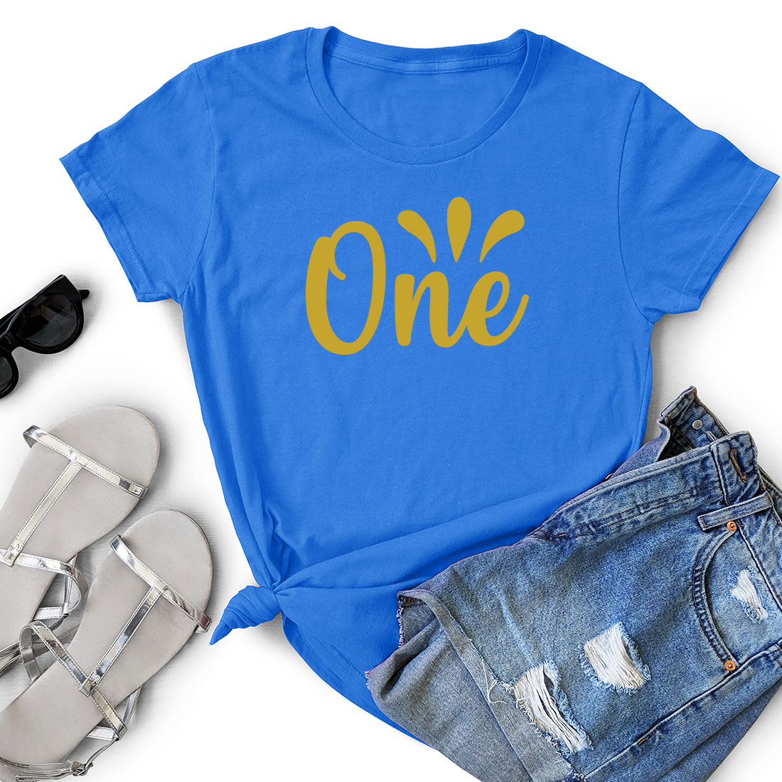 T - shirt with the word one on it next to a pair of shorts.