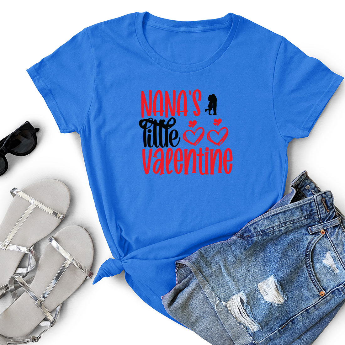 T - shirt that says mama's little valentine next to a pair of.