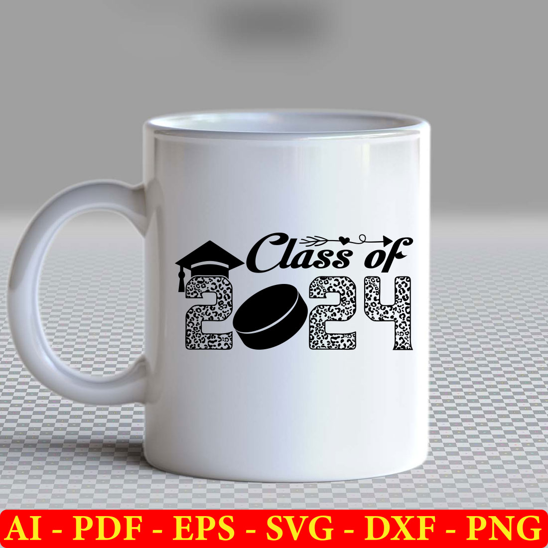 White coffee mug with a graduation cap on it.