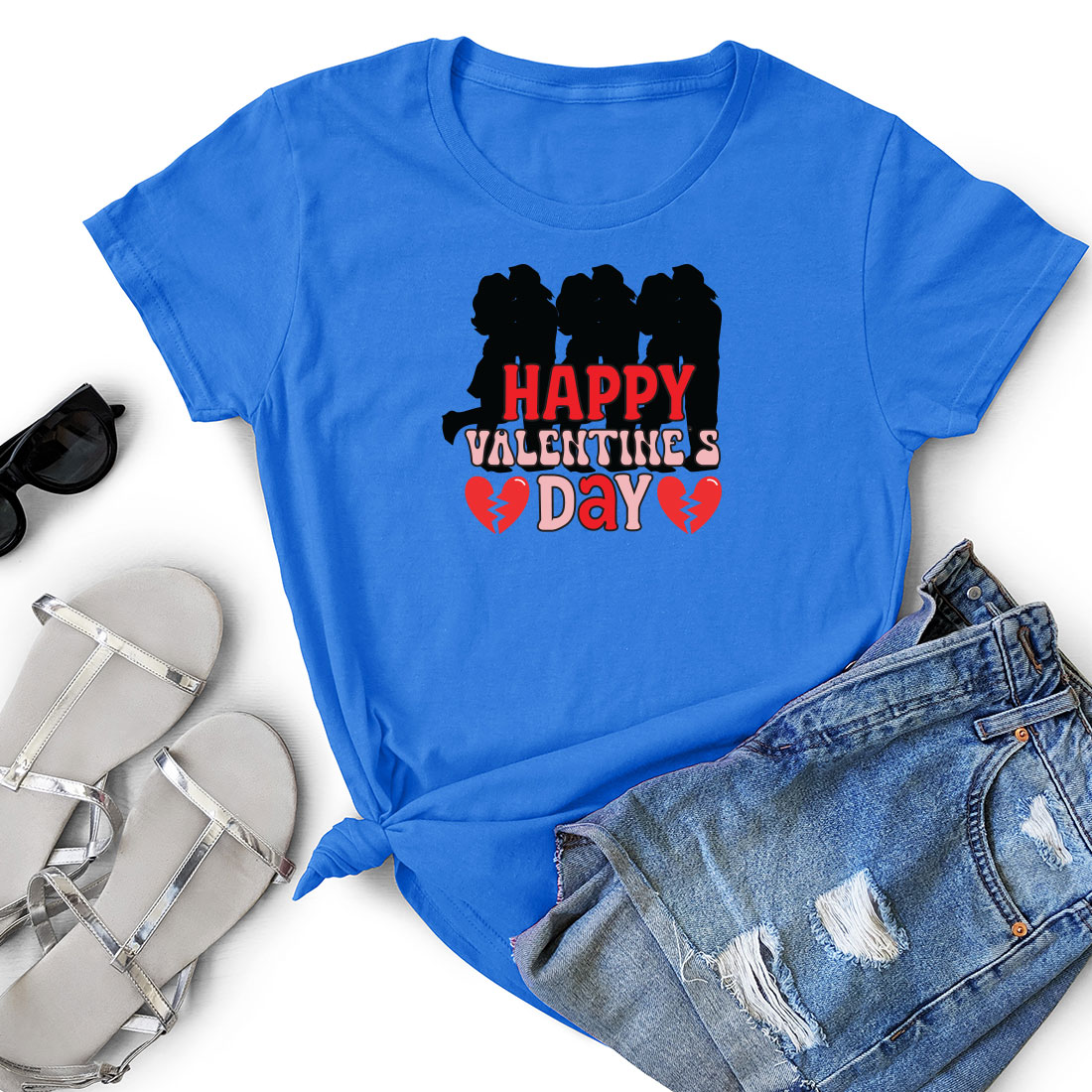 T - shirt that says happy valentine's day next to a pair of.