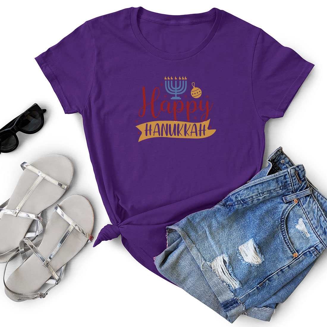 Women's happy hanukkah t - shirt next to a pair.