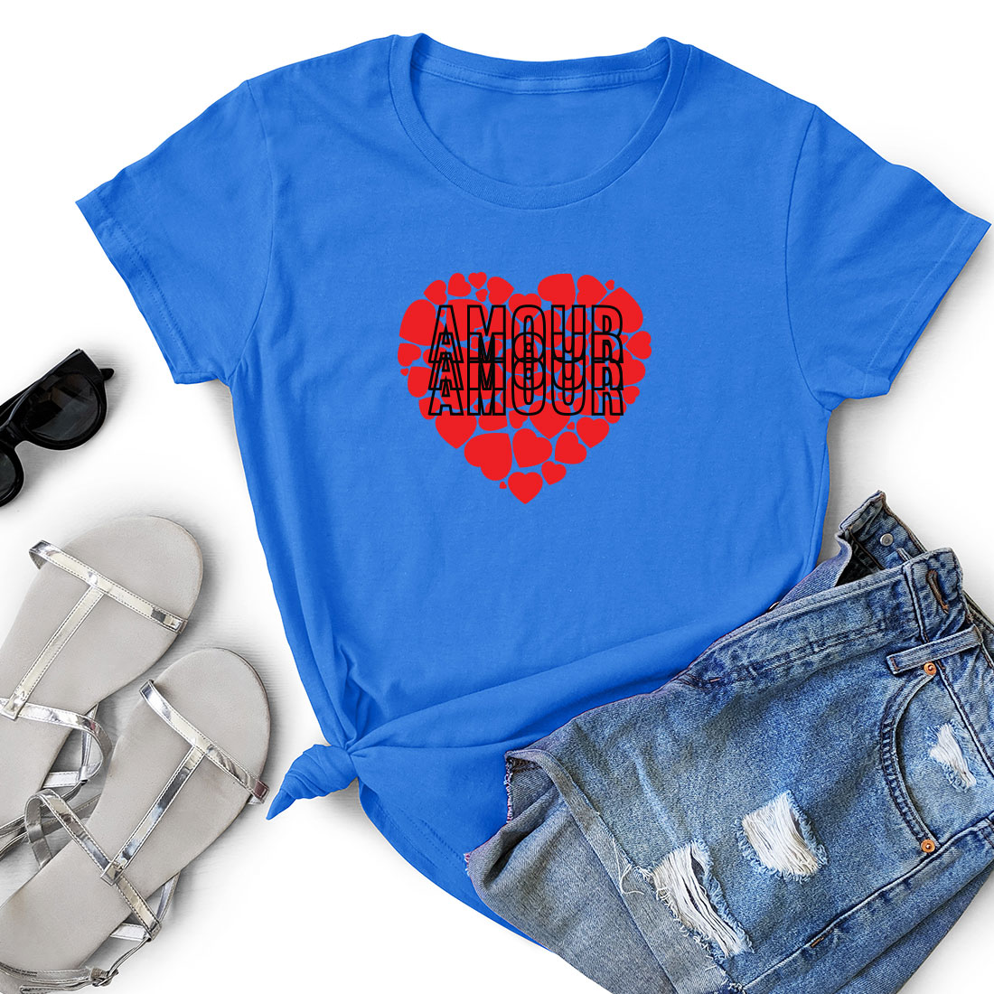 Blue t - shirt with a red heart and a pair of shorts.