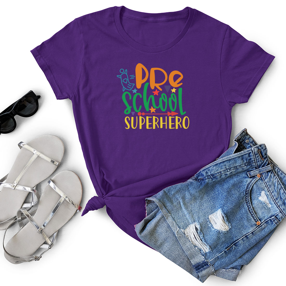 Purple shirt with the words pre school superhero on it.