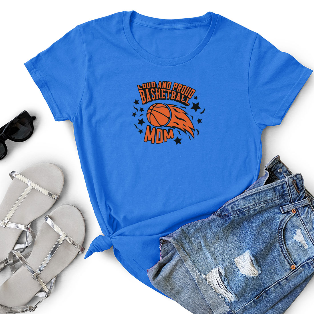 T - shirt with a basketball on it next to a pair of shorts.
