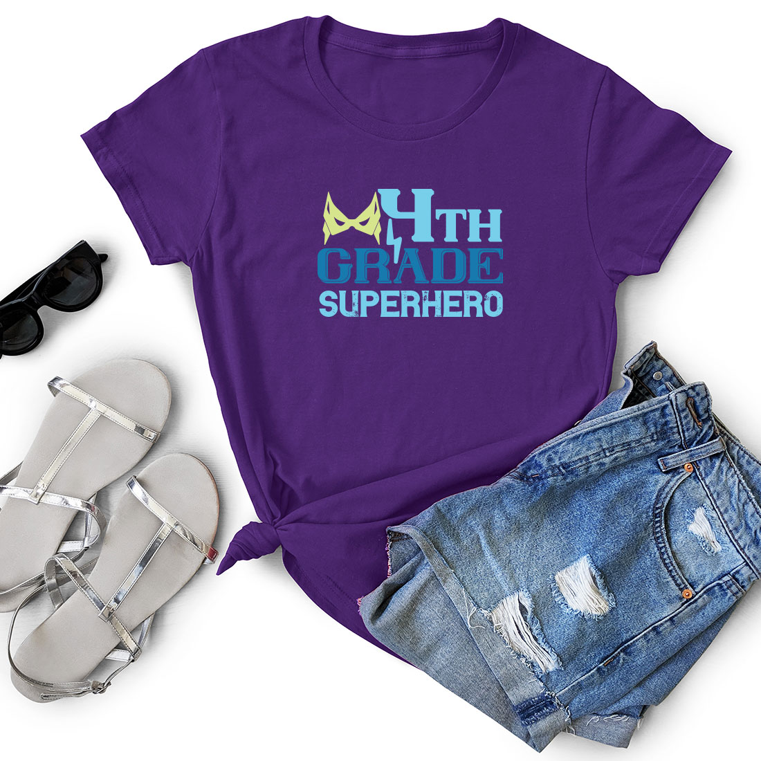 Purple t - shirt with the words fifth grade superhero on it.