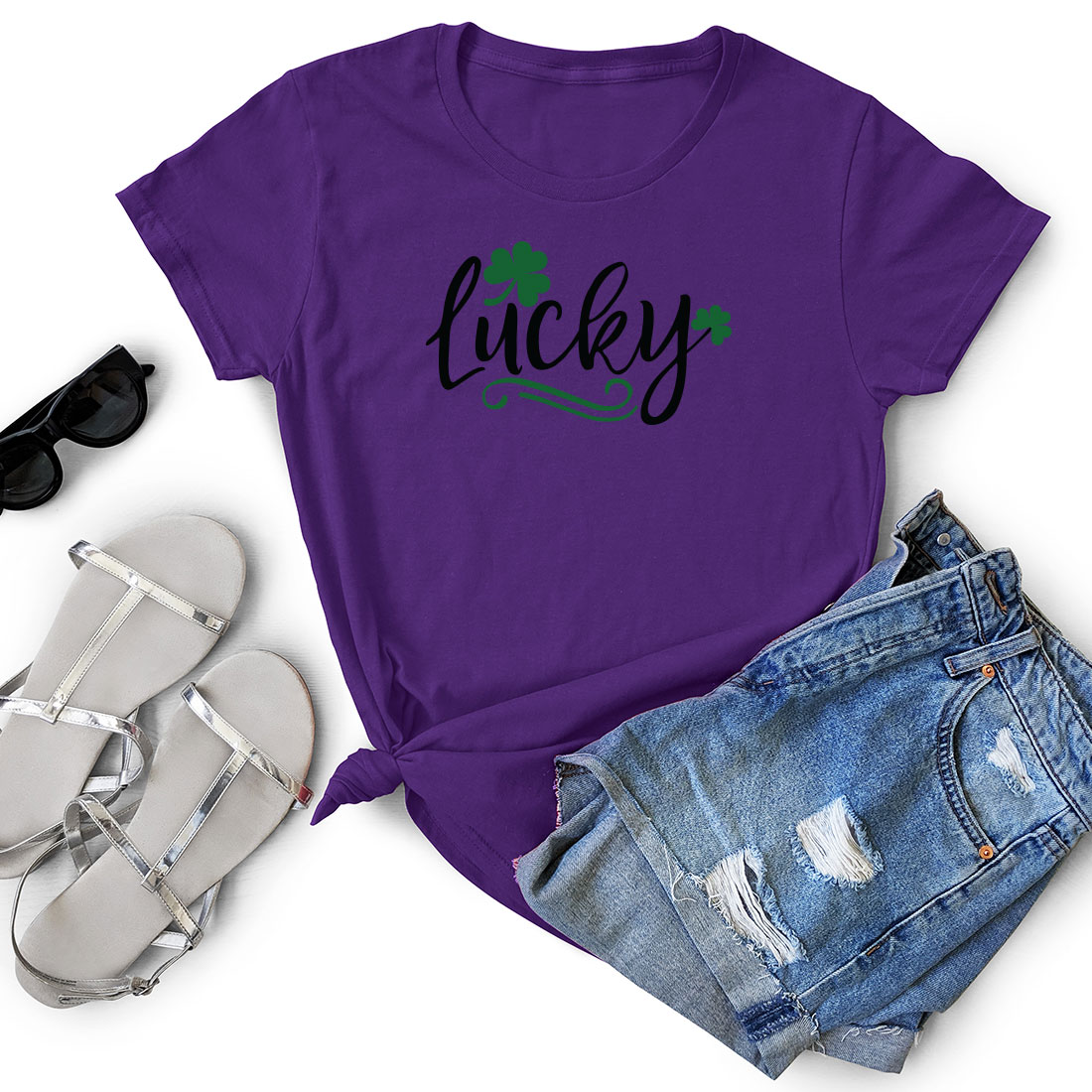 T - shirt that says lucky next to a pair of shorts.