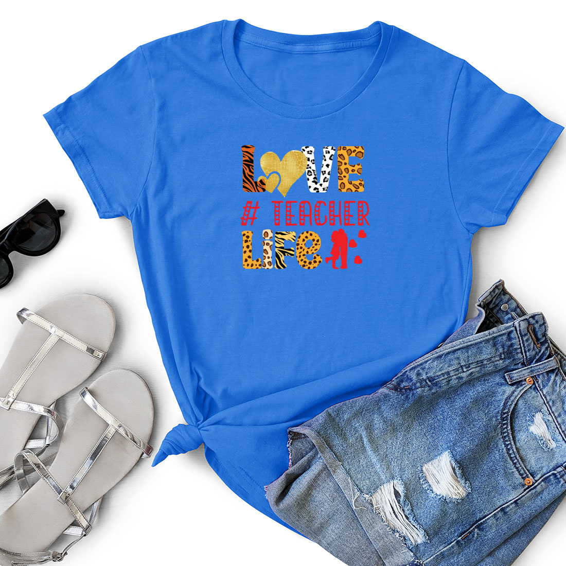 Blue t - shirt with the words love is teacher love and a pair of.