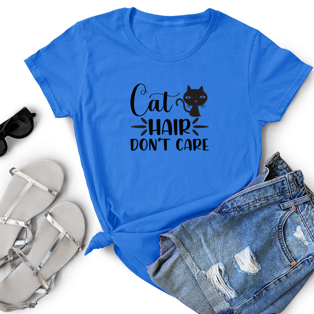 T - shirt that says cat hair don't care next to a pair.