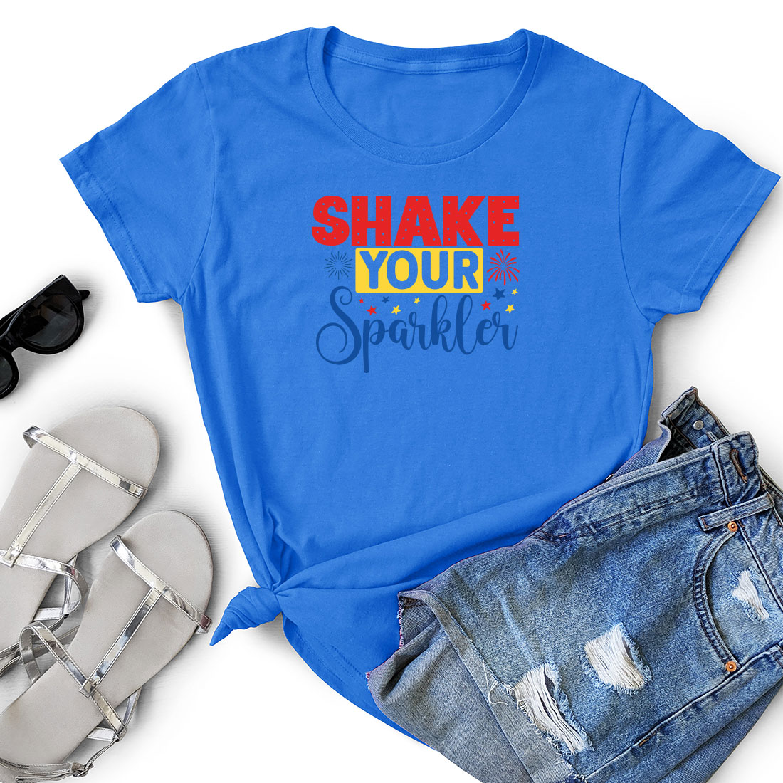 T - shirt that says shake your sparkler next to a pair of shorts.