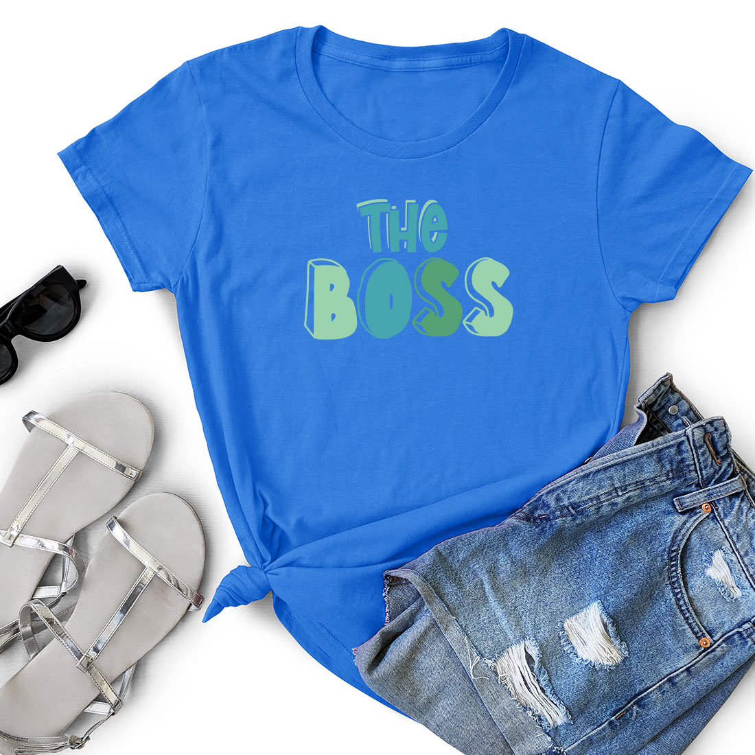 T - shirt that says the boss next to a pair of shorts.