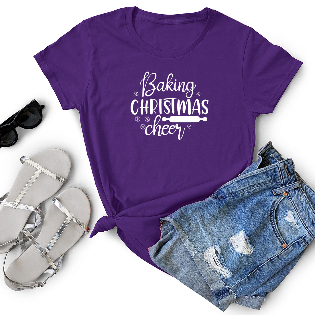 T - shirt that says baking christmas cheer next to a pair of shorts.