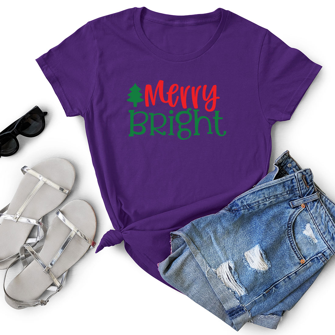 T - shirt that says merry bright next to a pair of shorts.