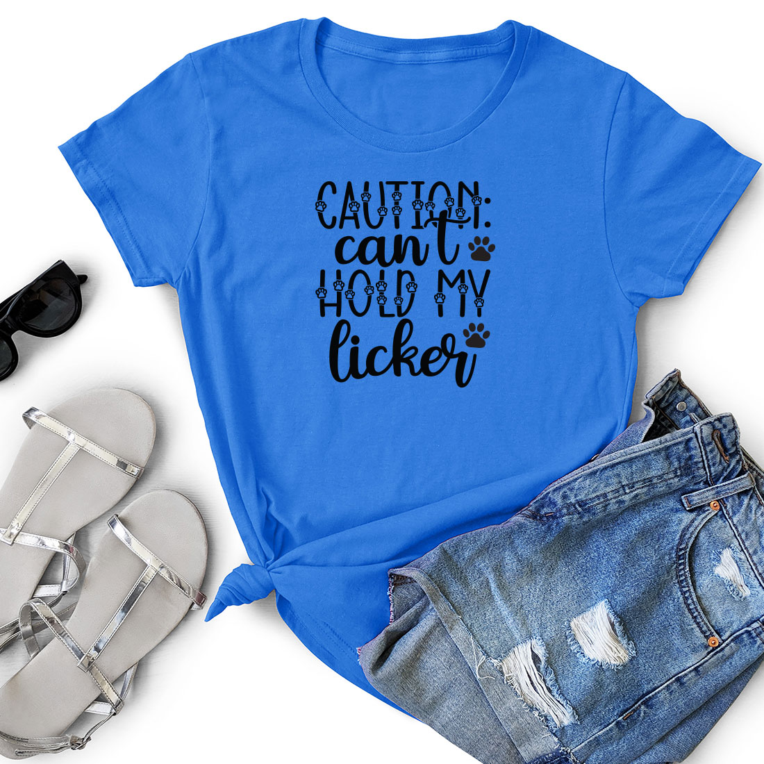 Blue shirt that says caution can't hold my licker.