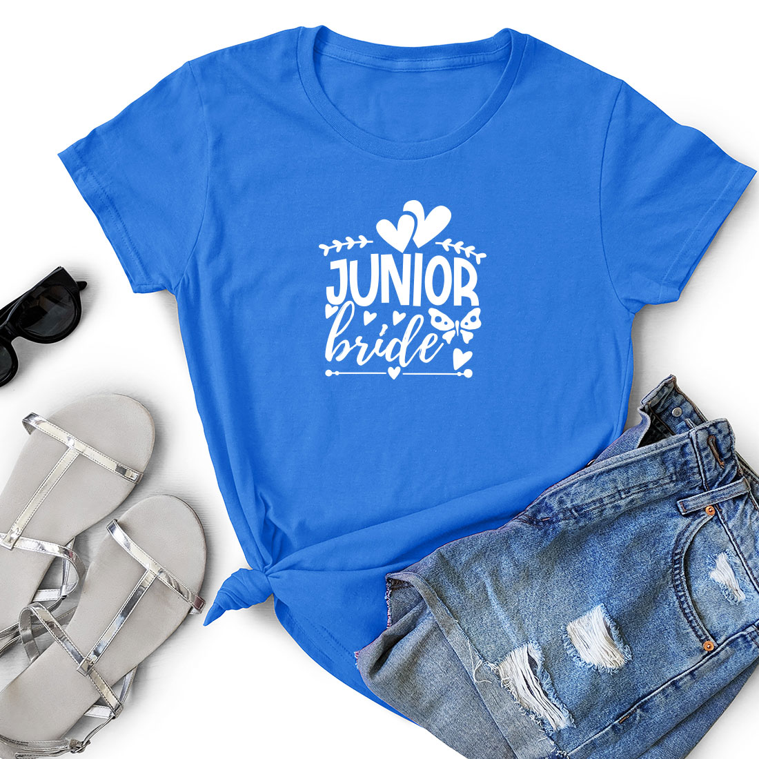 T - shirt that says junior bride next to a pair of shorts.