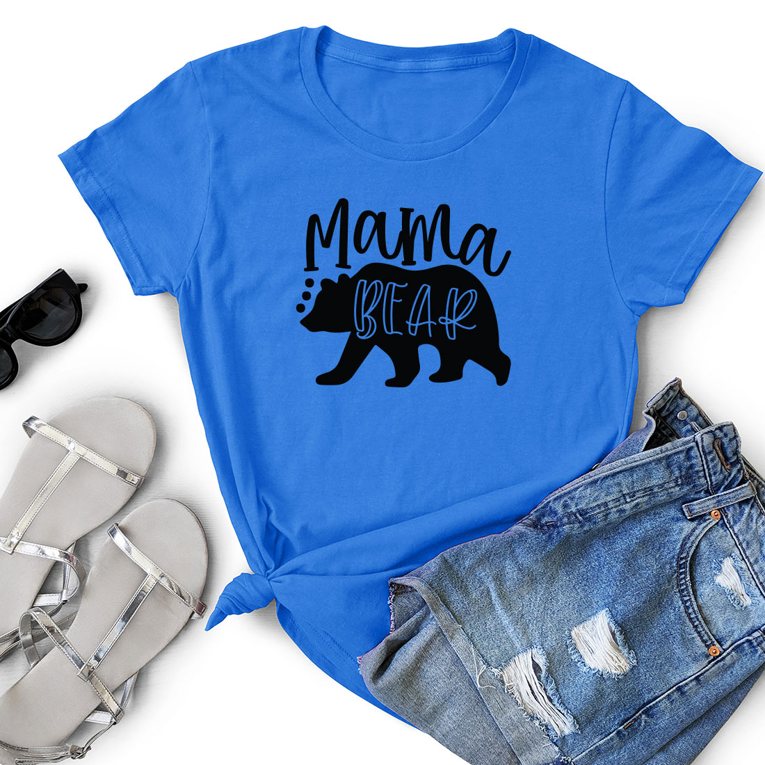 Blue shirt that says mama bear next to a pair of shorts.