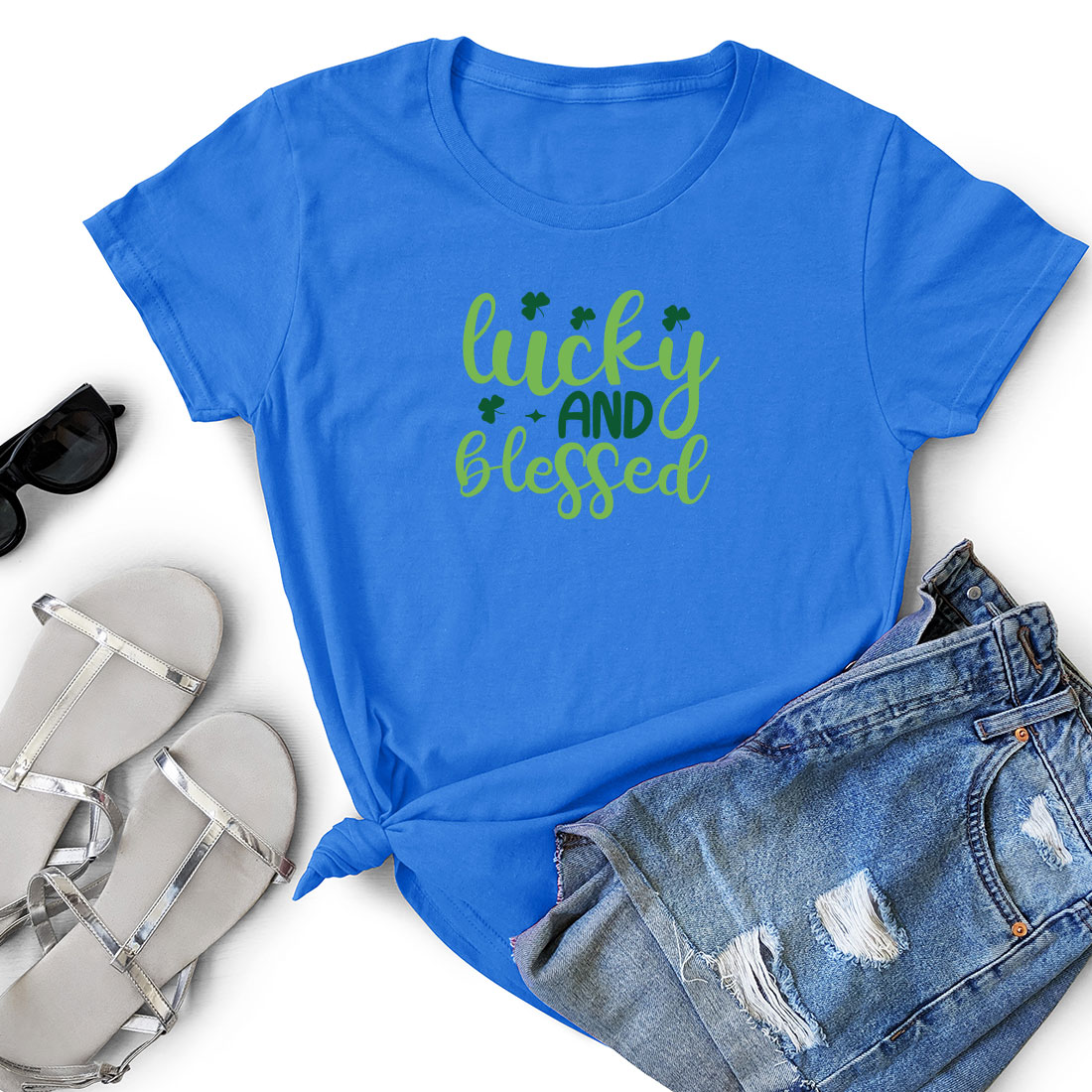 Blue t - shirt with the words lucky and kissed next to a pair of.