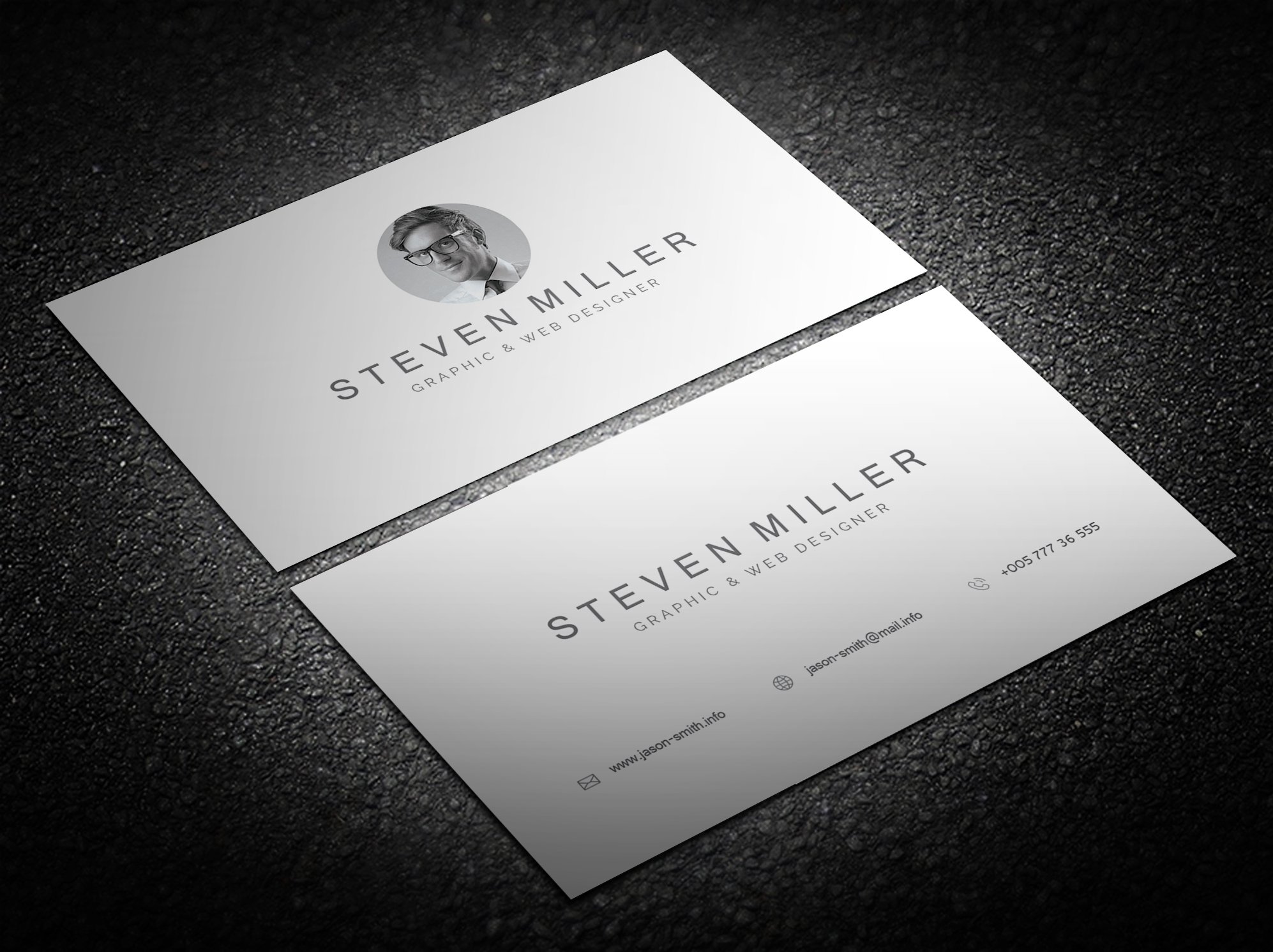 Two white business cards with a black and white photo.