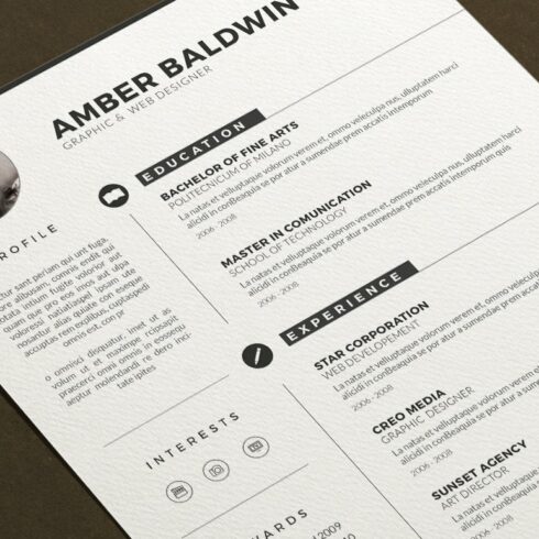 Clean and modern resume is displayed on a table.