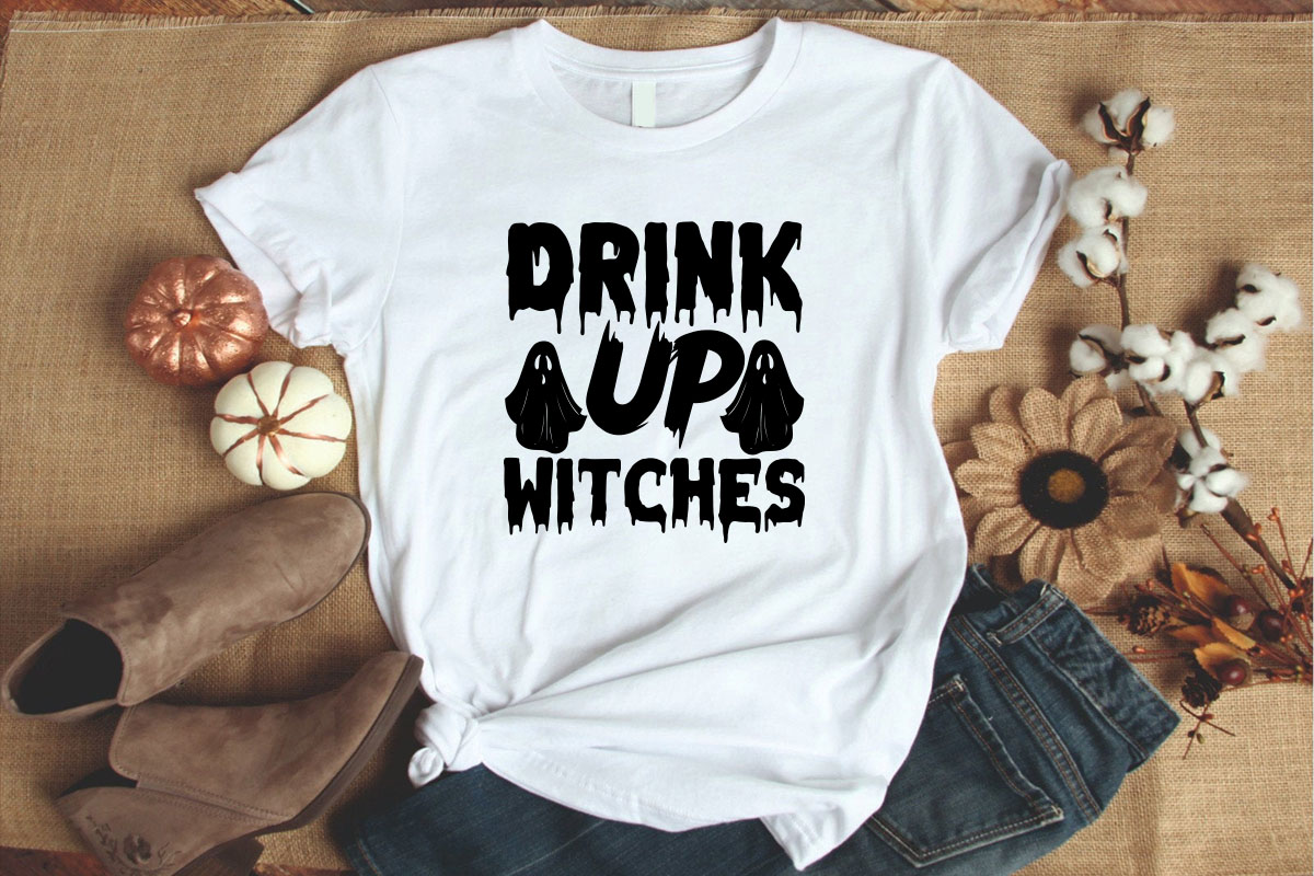 White shirt with the words drink up witches on it.