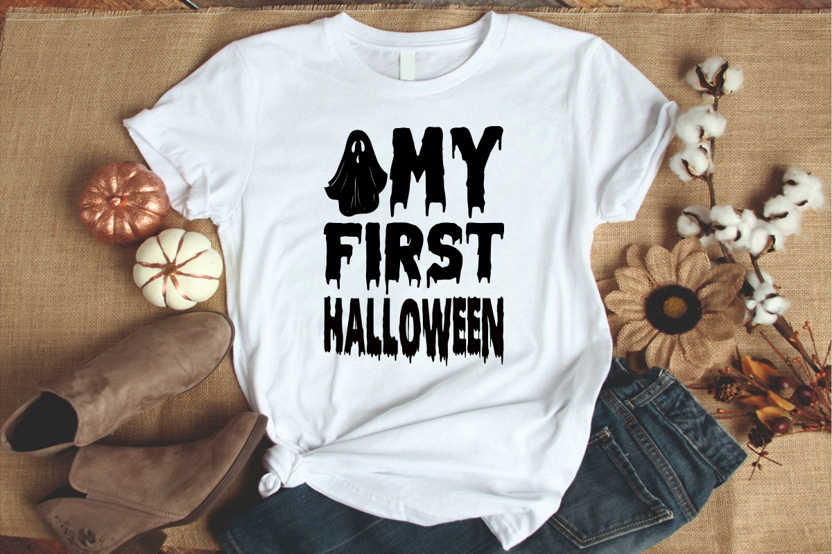 White shirt that says my first halloween.