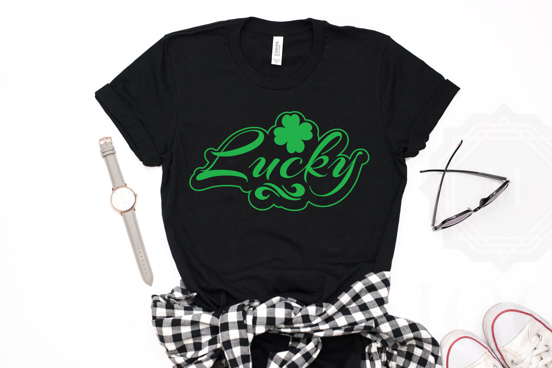 T - shirt that says lucky with a bow around it.