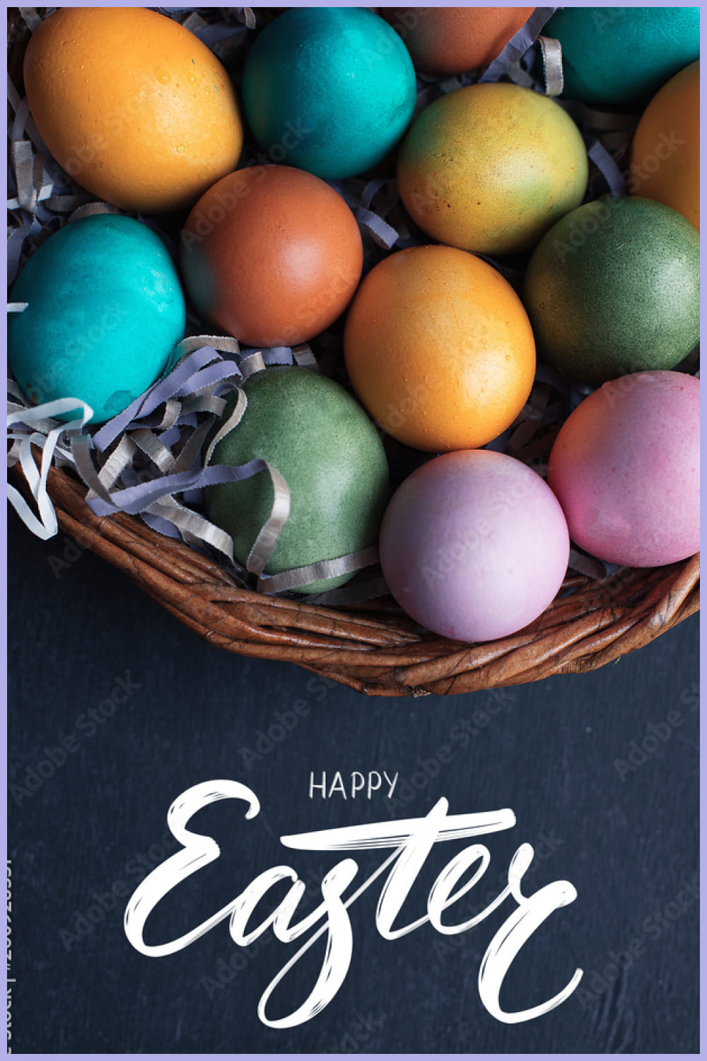 Happy Easter hand lettering inscription and colorful easter eggs in basket on black wooden background.