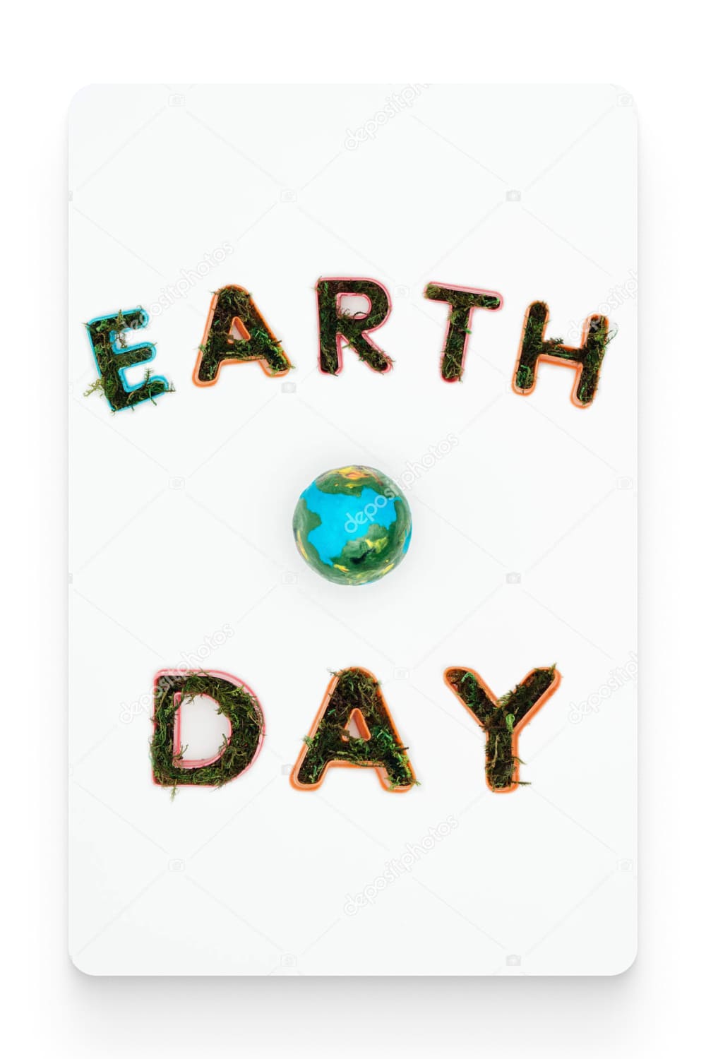 Top view of earth model with text earth day isolated on white.