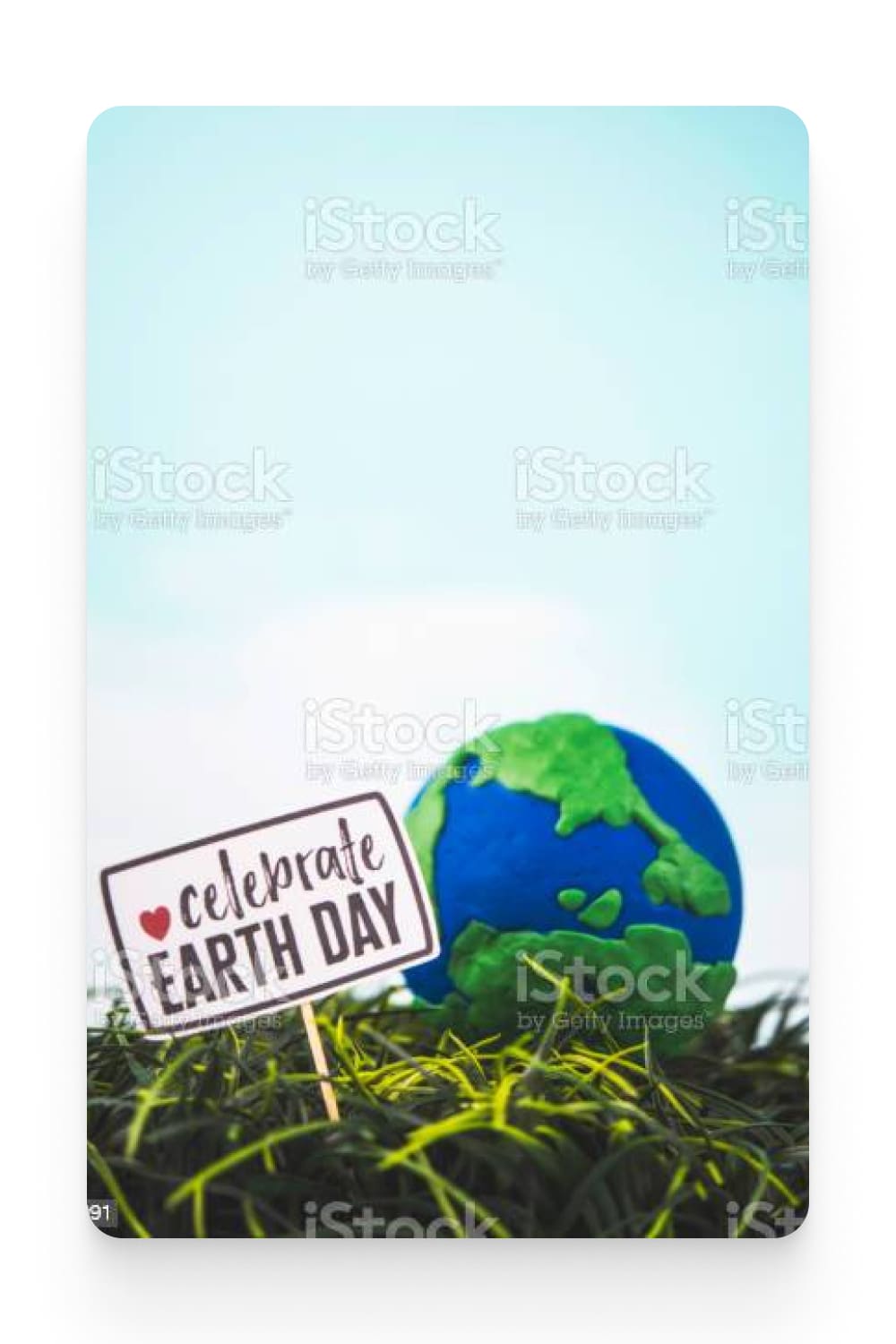 Handmade globe in grass with sign to Celebrate Earth Day. Save the planet *Earth prop.