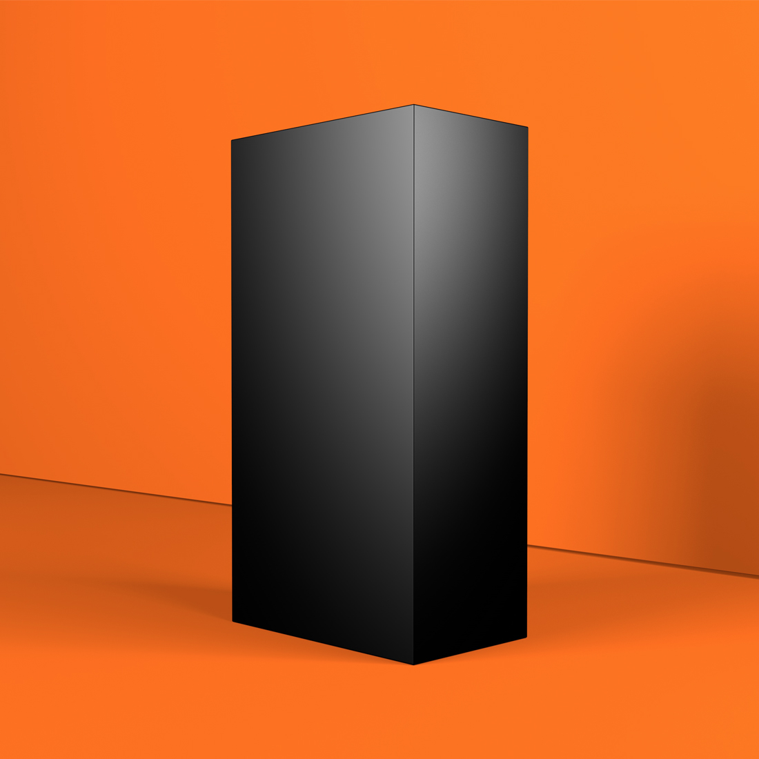 Black box sitting on top of an orange floor.