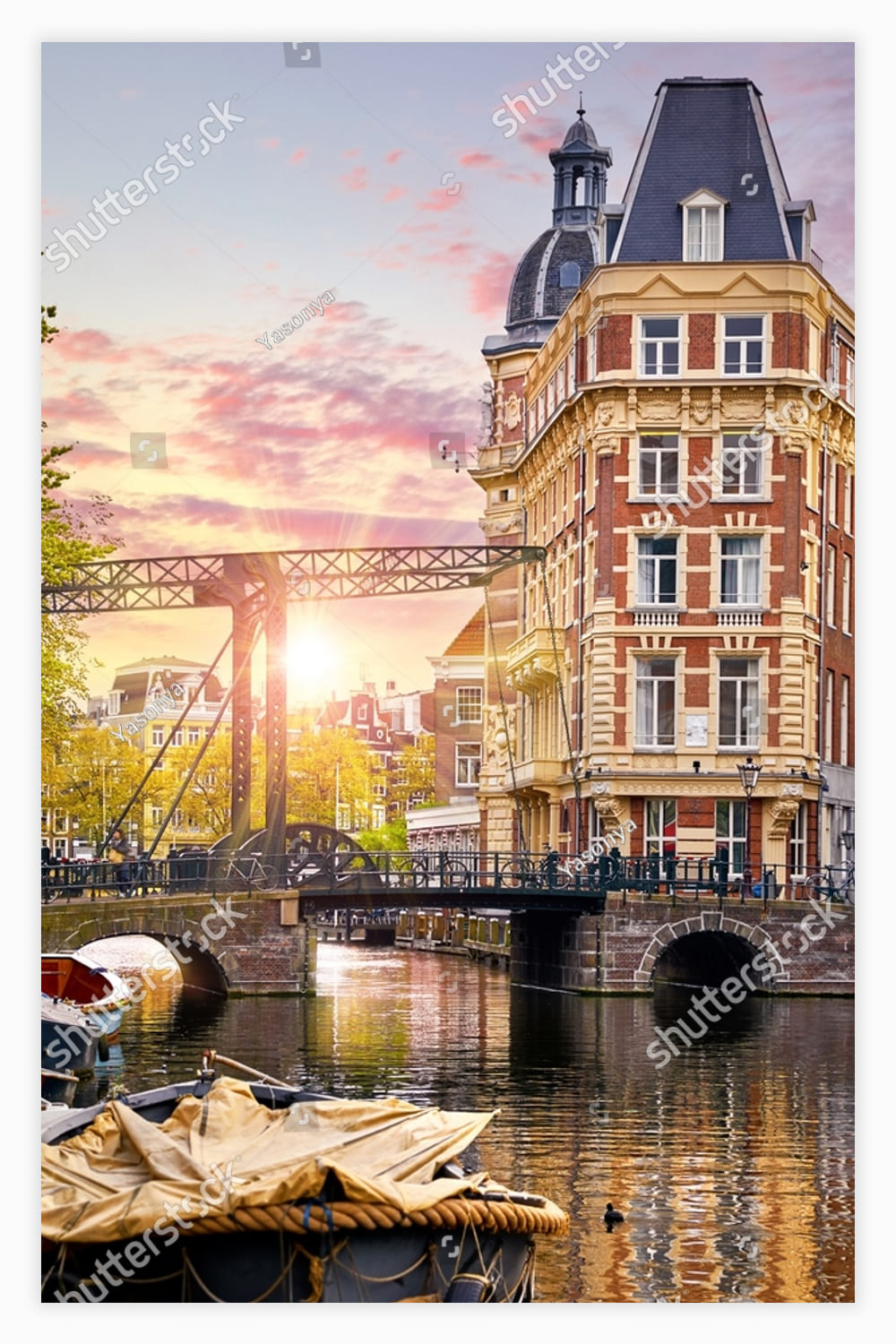 Panoramic view of autumn Dutch city. Famous channel of Amstel river.