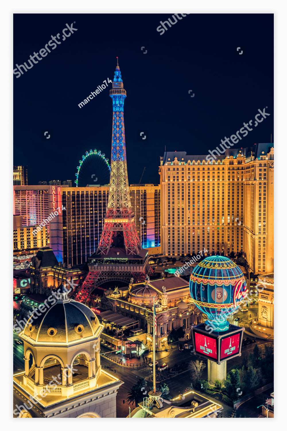 Illuminated hotels and casinos by the strip at night, Nevada, USA..
