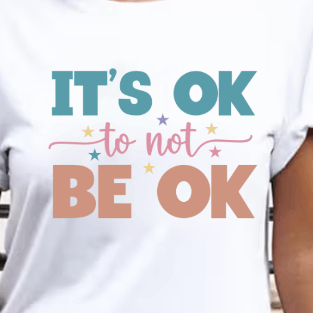 Woman wearing a t - shirt that says it's ok to not be.