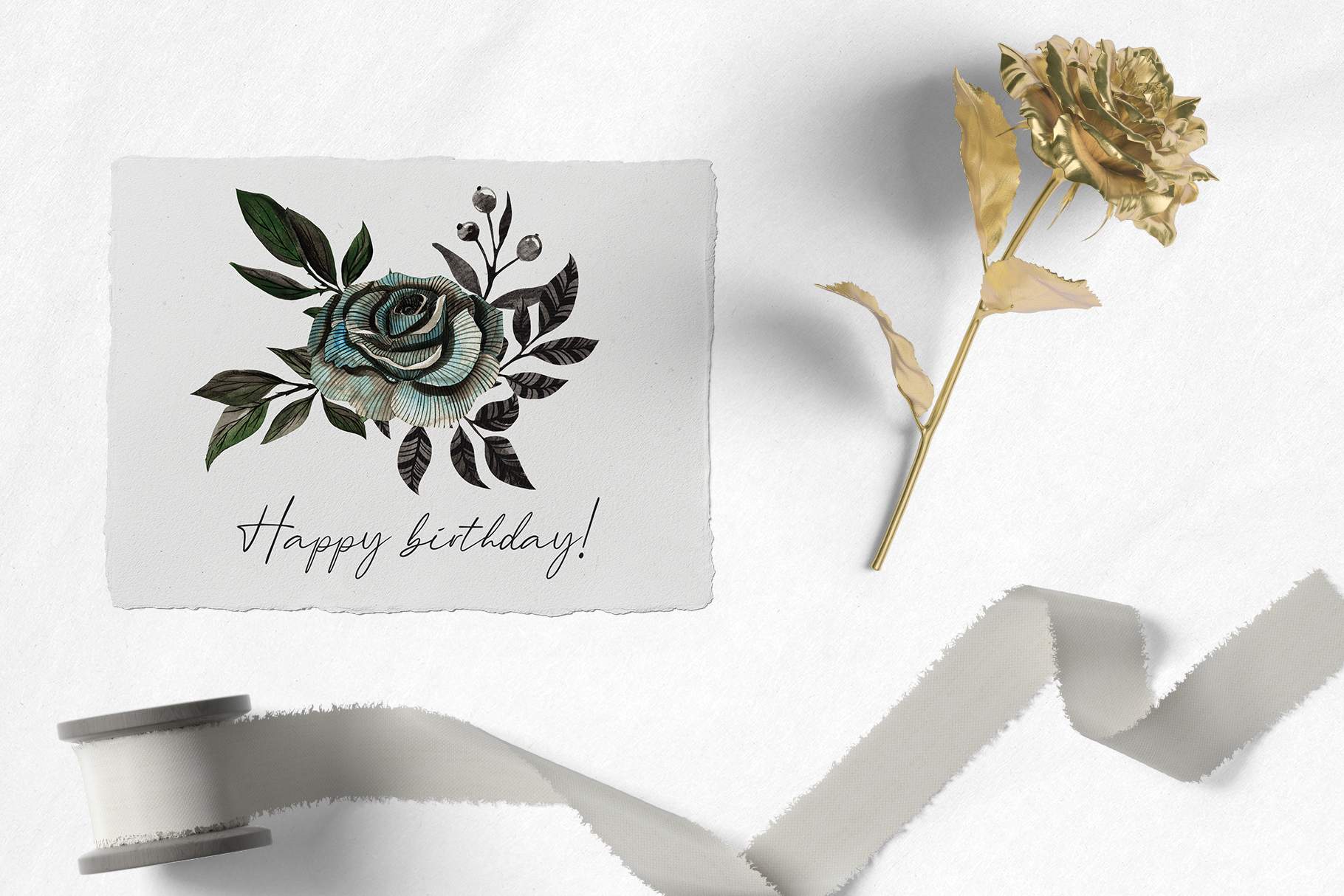 Card with a rose and a ribbon on it.