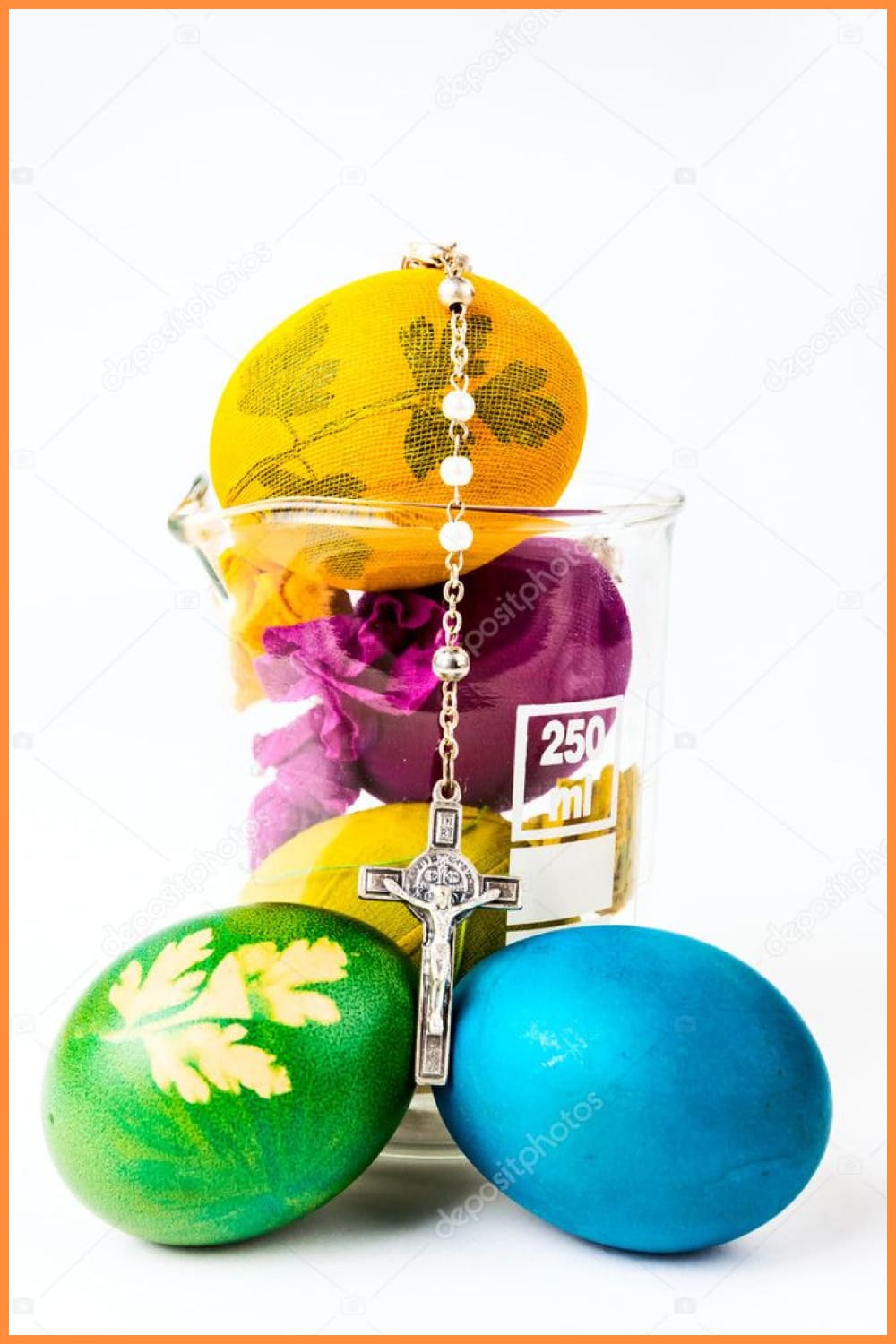 Easter eggs with rosary on lab glass.