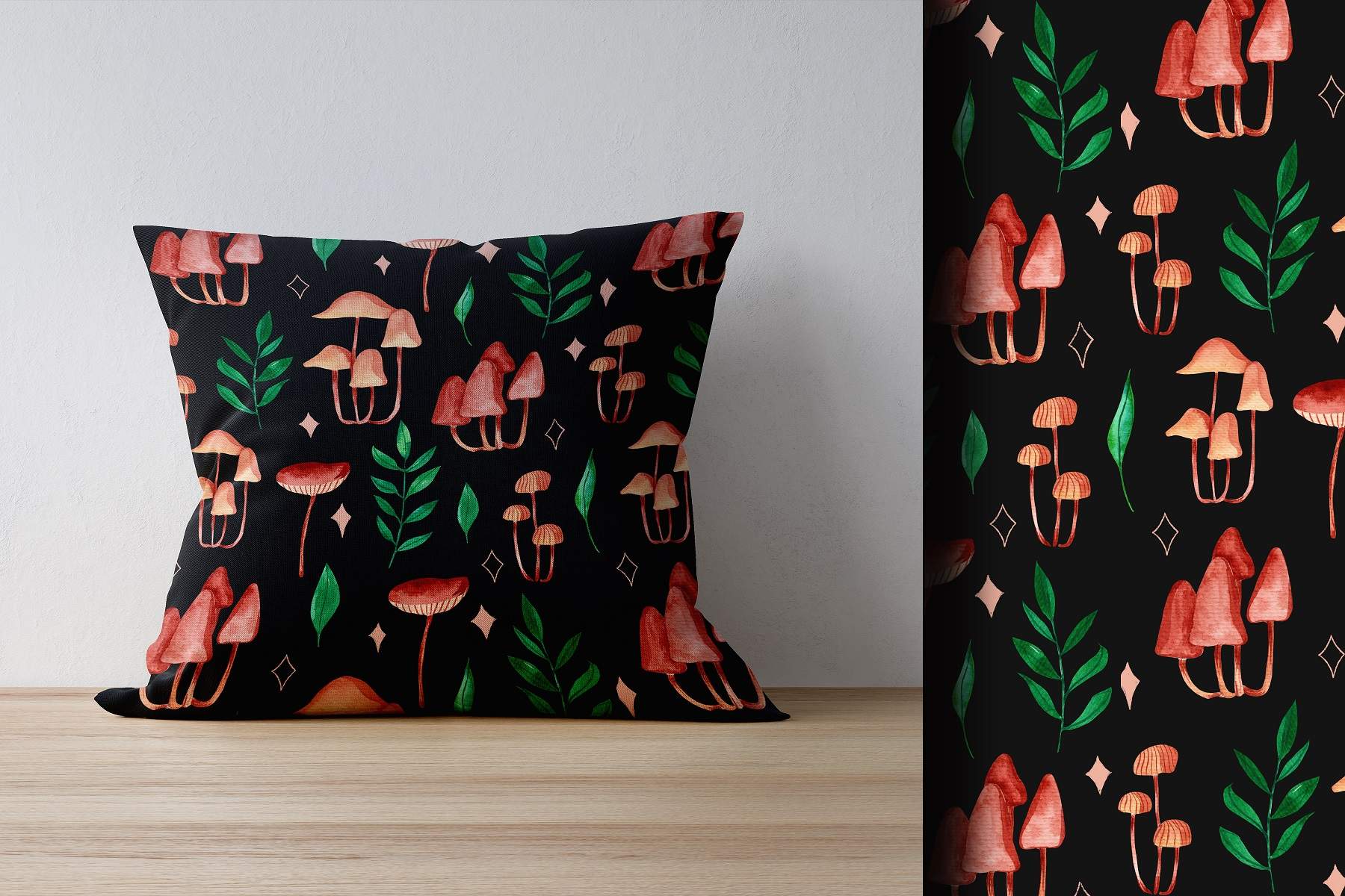 Black pillow with pink and green mushrooms on it.