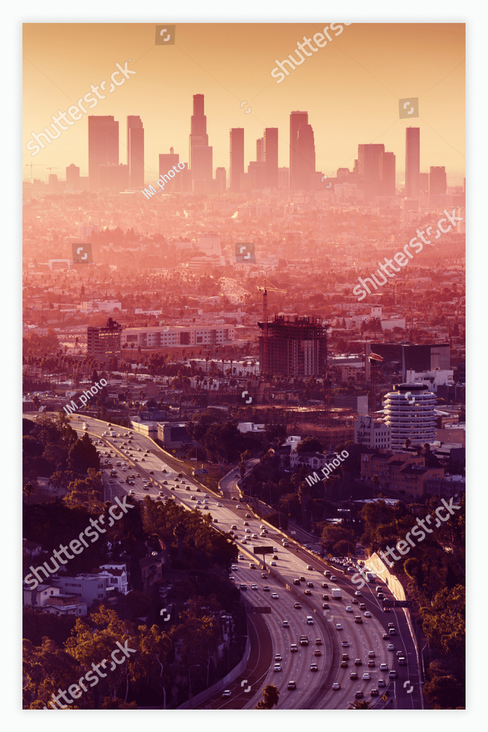 Los Angeles - California City Skyline at Sunset in the Background.