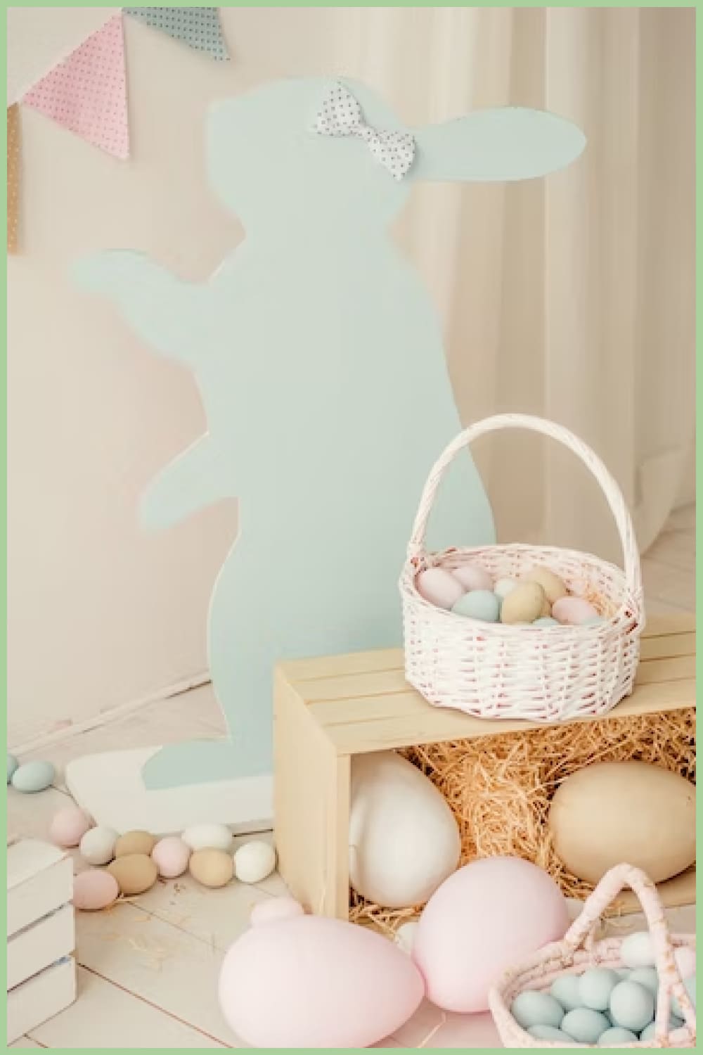Basket with Easter eggs on a box with straw.