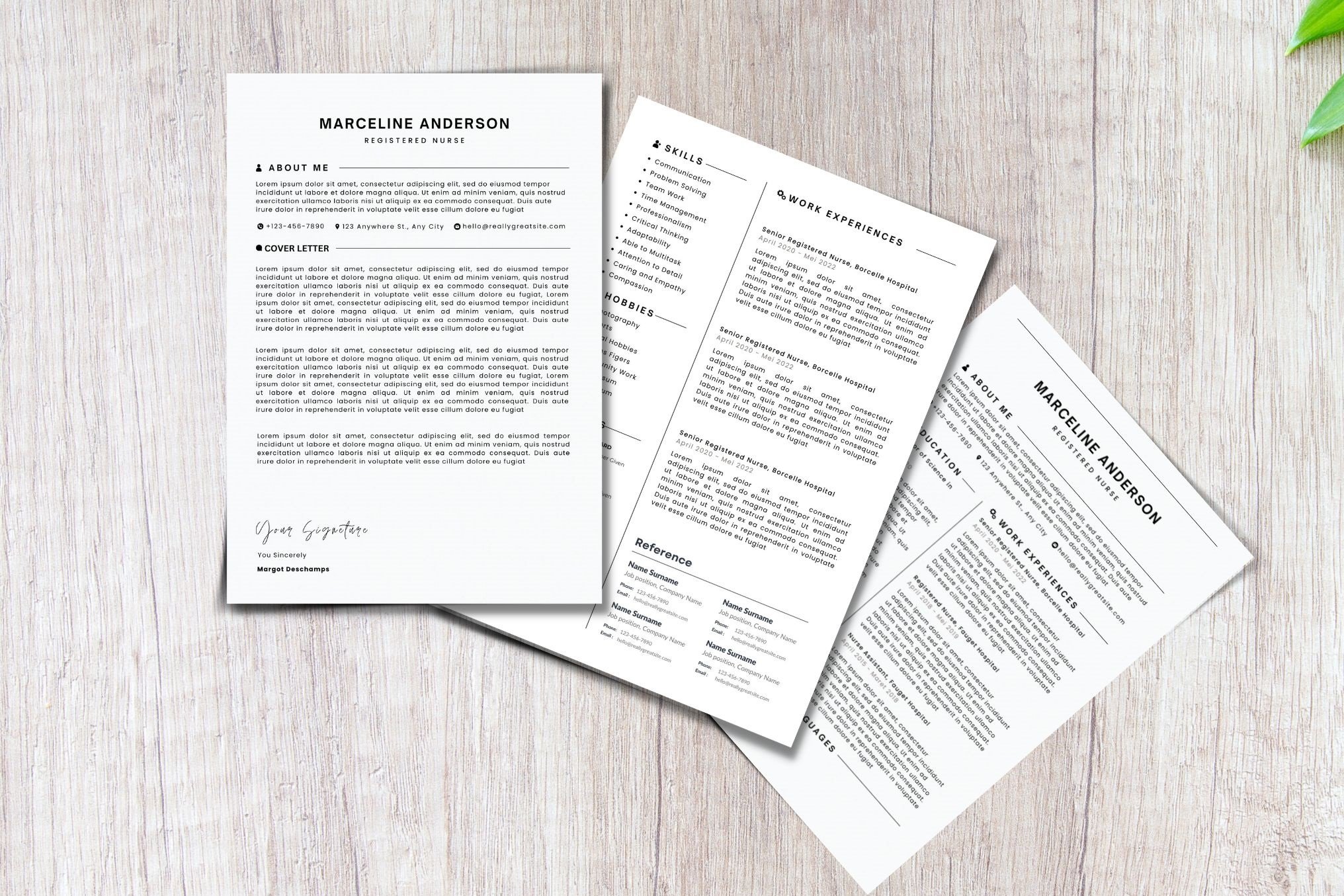 Three pages of a resume sitting on top of a wooden table.
