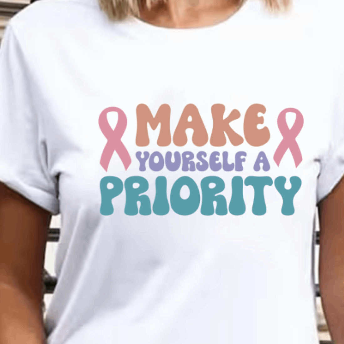 Woman wearing a t - shirt that says make yourself a priority.