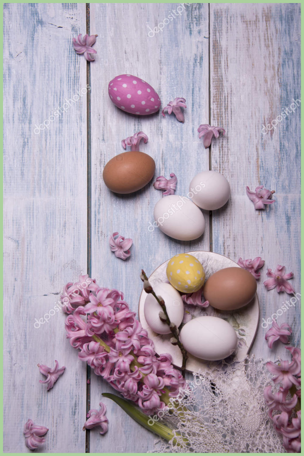 Happy Easter card template with pink Hyacinth flowers and eggs on wooden background.