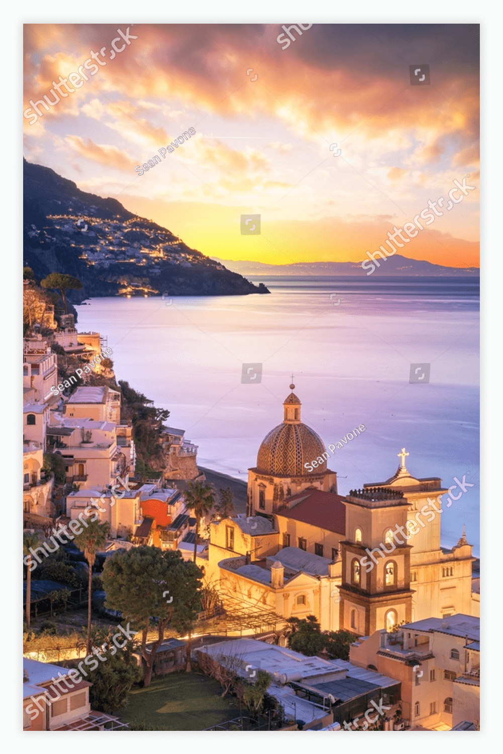 Positano, Italy along the Amalfi Coast at dusk.