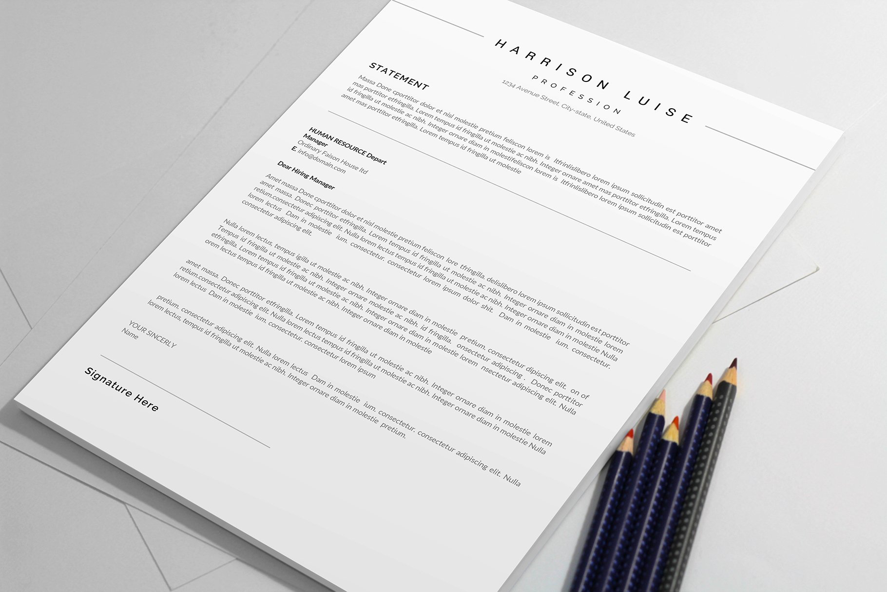 Professional resume template with pencils on top of it.