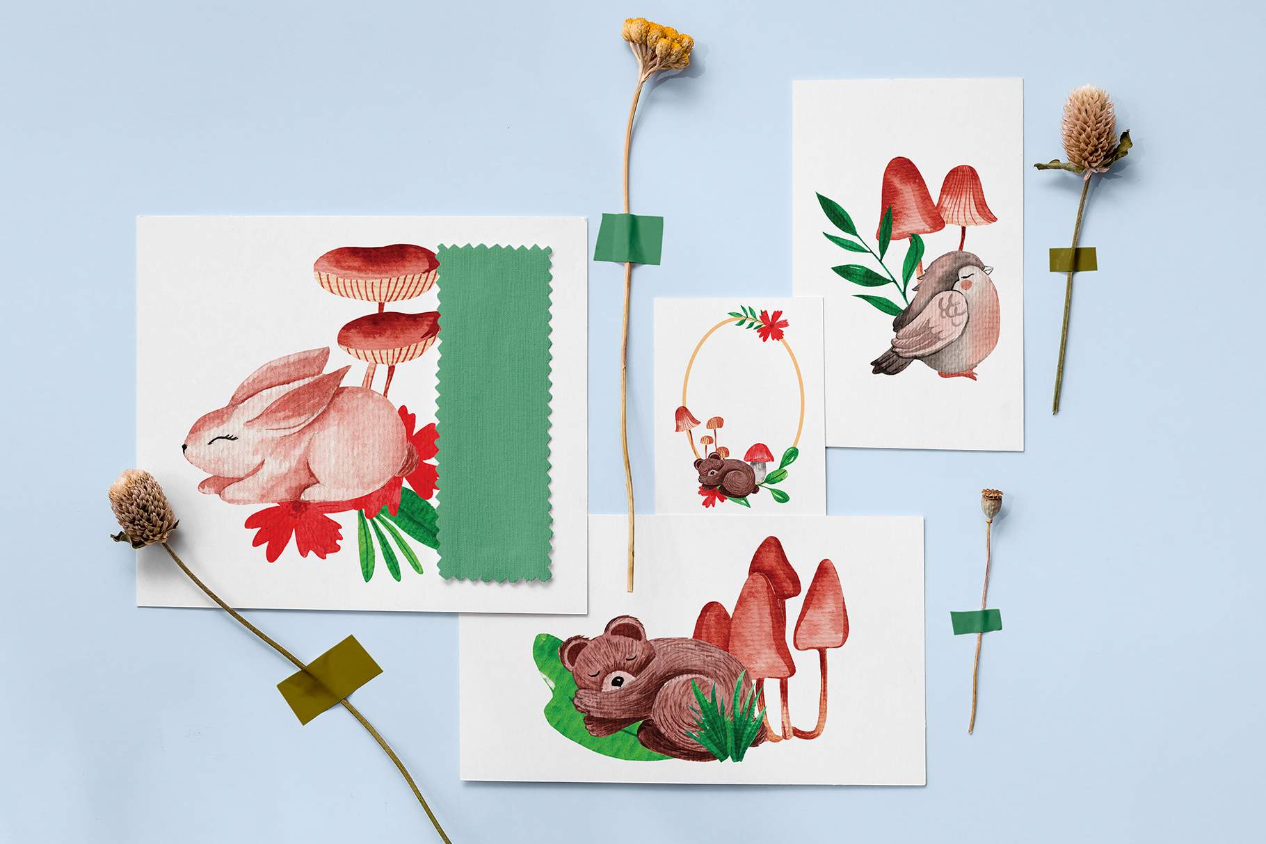 Group of cards with flowers and animals on them.