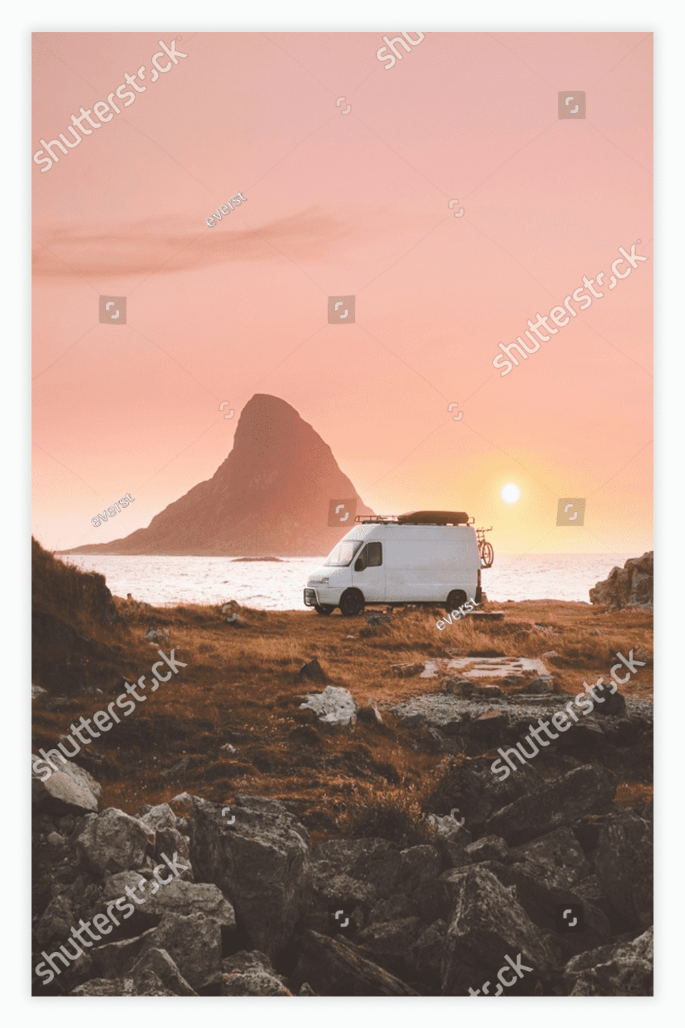 Van car camper at sunset ocean beach road trip in Norway.