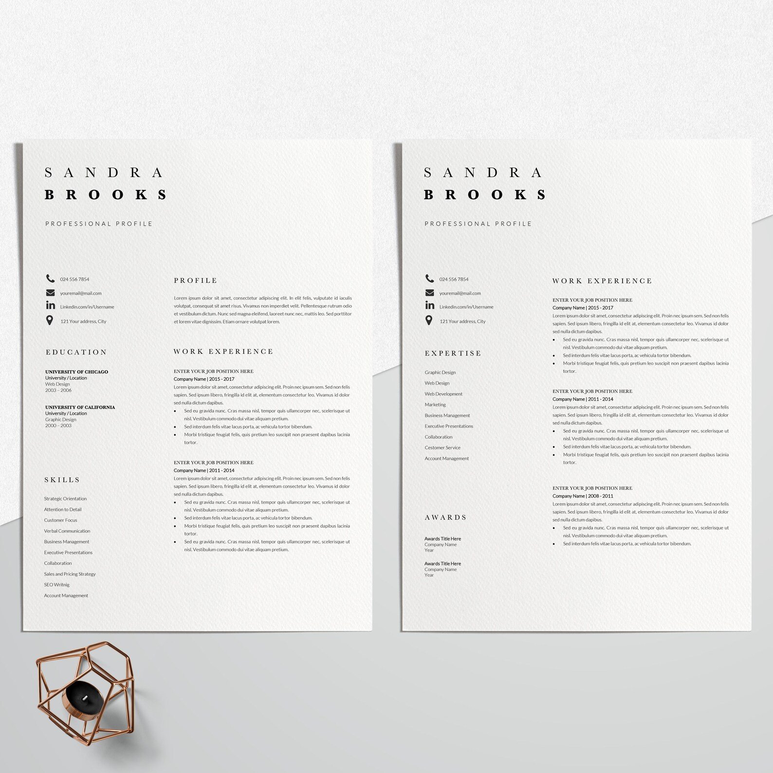 Two resumes on a table next to a cup of coffee.