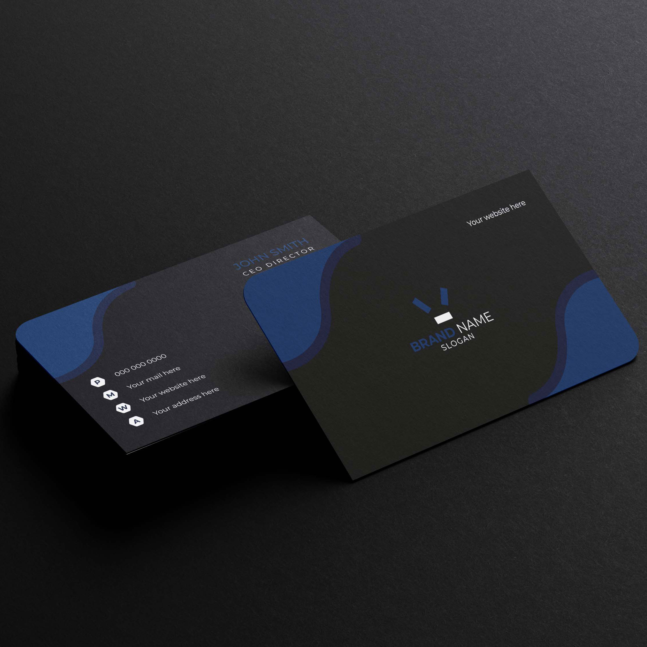 Black and blue business card on a black surface.