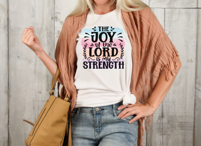 Woman wearing a t - shirt that says the joy of the lord is my.