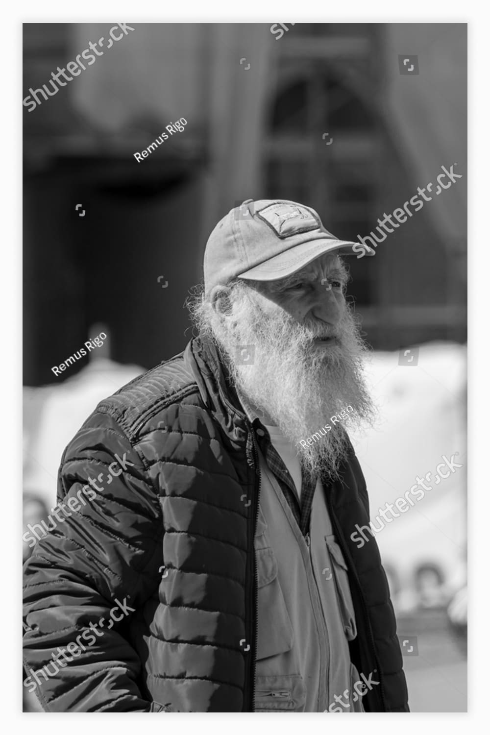 Black and white photo of a man with a long white beard.